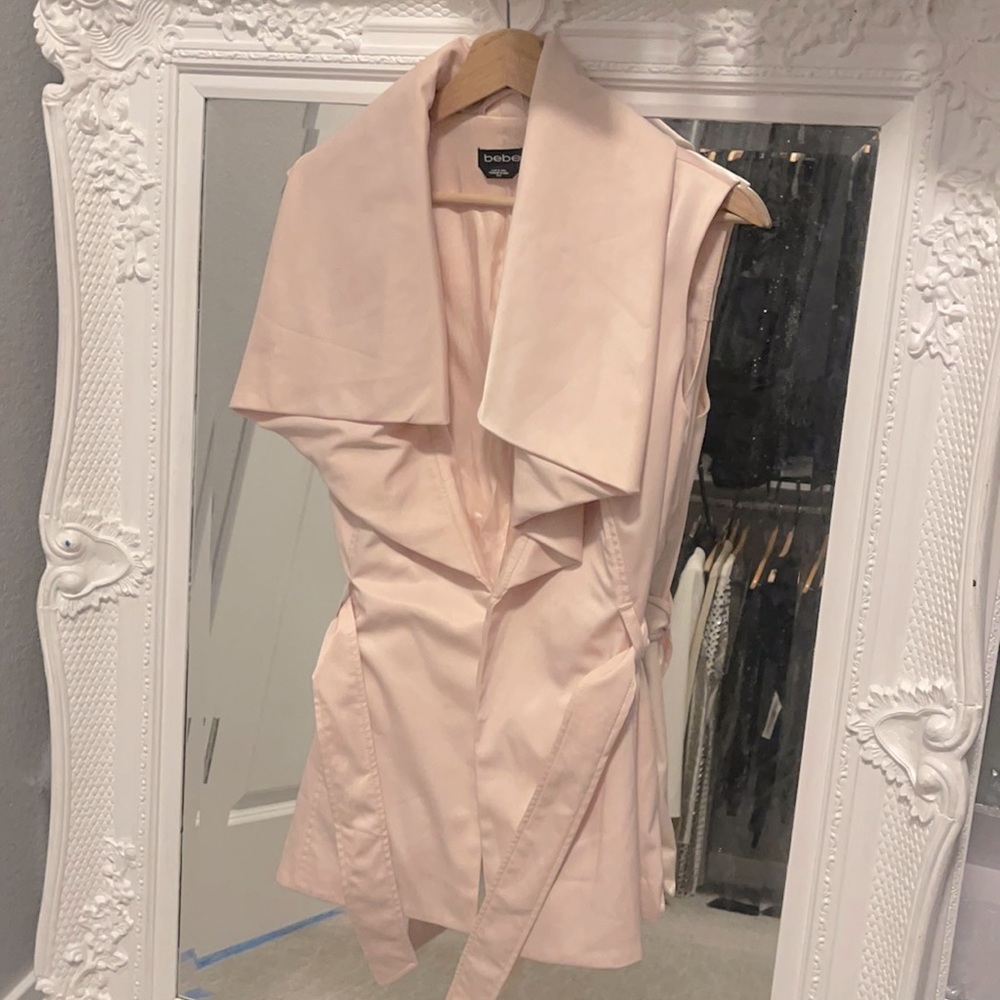 Sleeveless pink coat vest